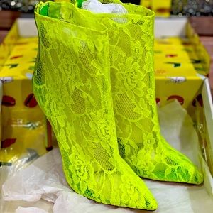 Lemon Drop neon green heeled boots.